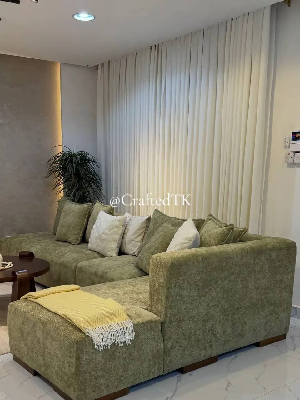 Olive green chenille corner sofa with ottoman and scatter cushions