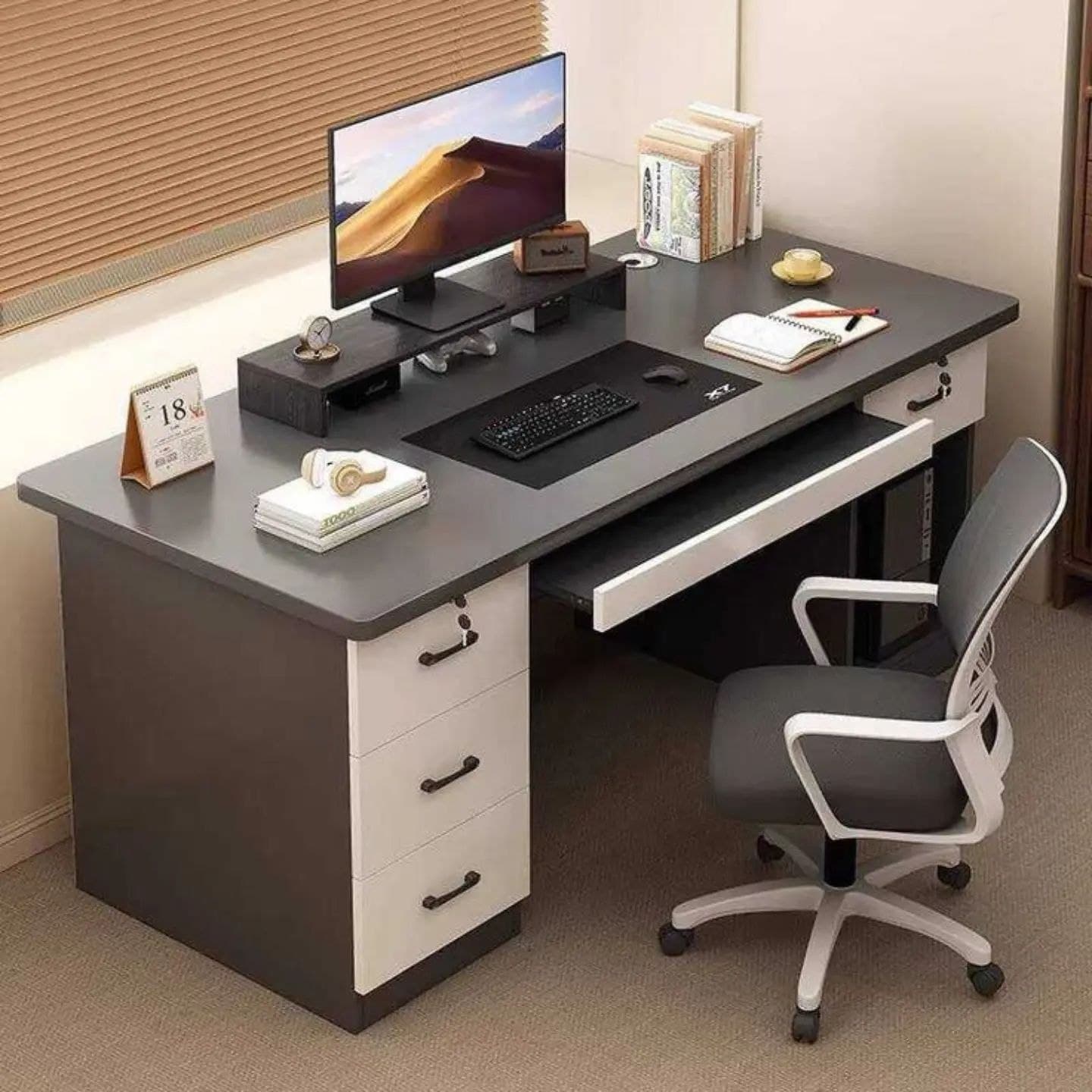Grey and white office desk with drawers and a matching swivel chair
